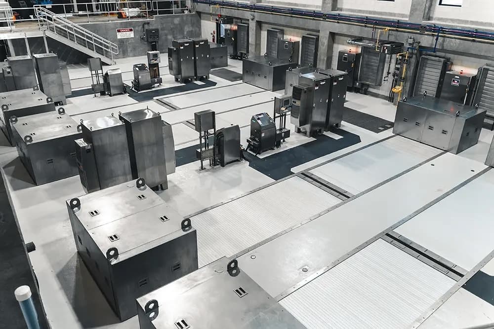 Rows of industrial equipment with floor-level covers