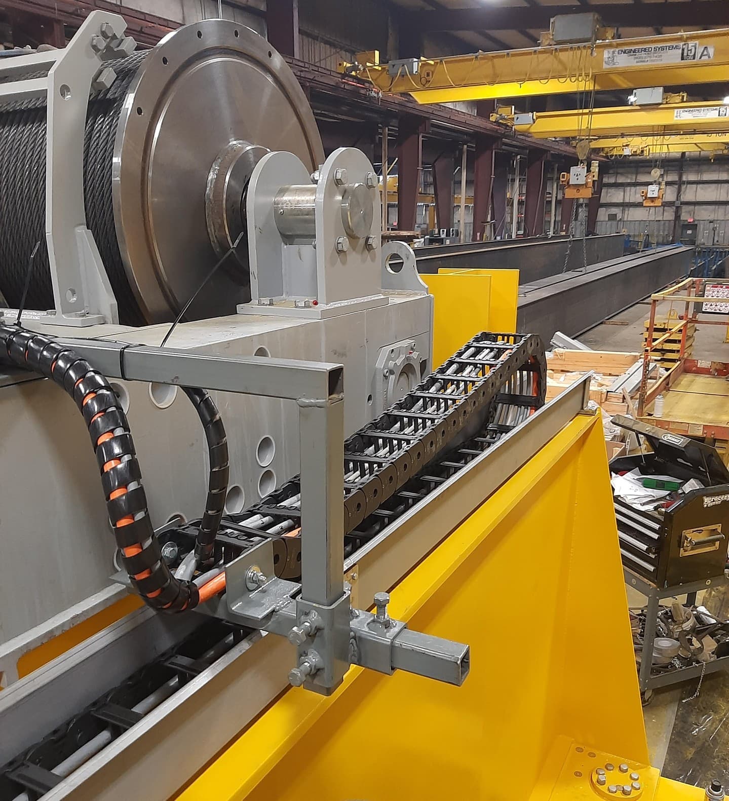 Cable carrier installed on industrial lifting equipment